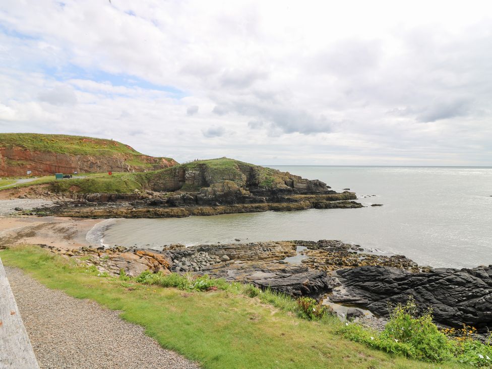 A coastline with rocks and cliffs at The Breakers in Newburgh, Aberdeenshire