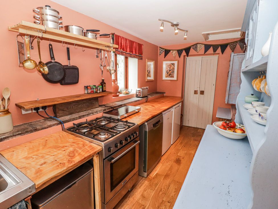 A kitchen with various appliances and utensils at Pencestyll in Cardigan