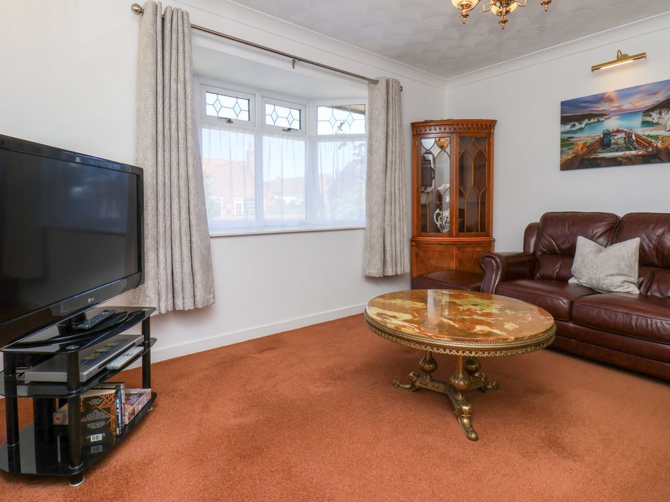 A living room with a sofa and a coffee table at Castelian in Flamborough