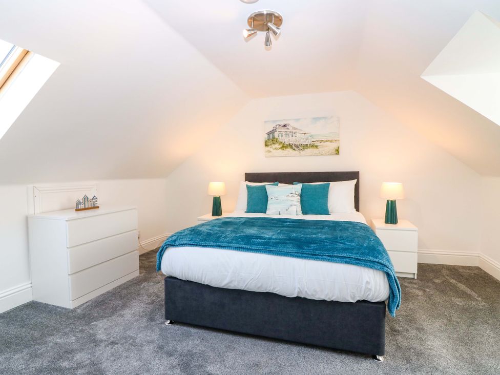 A bedroom with a bed and dresser at No.9 North St in Fraserborough