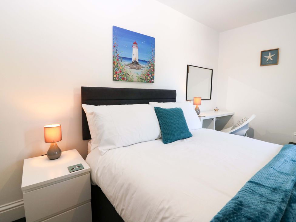 A bedroom with a bed and desk at No.9 North St in Fraserburgh