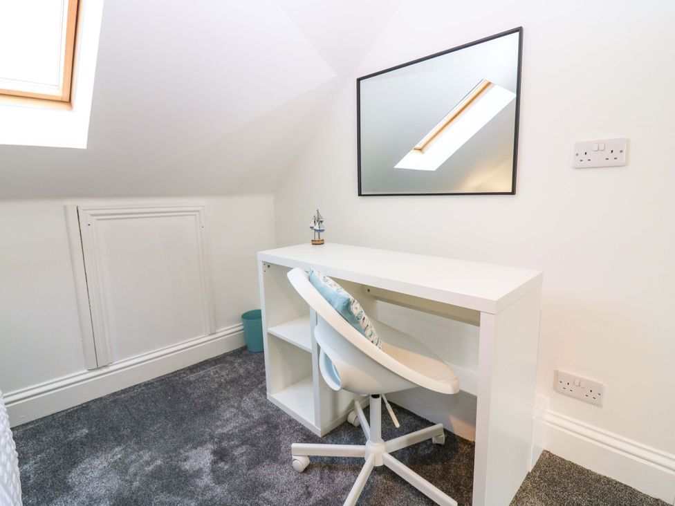 A home office with a desk and chair at No.9 North St, Fraserborough