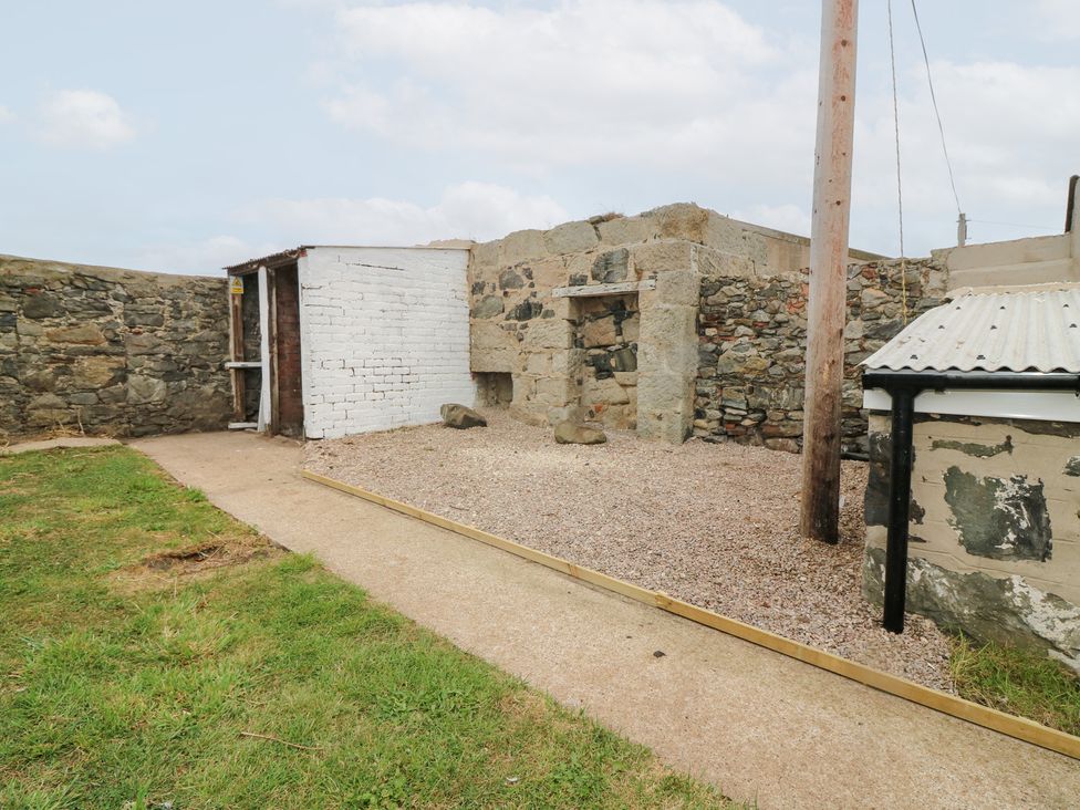 An outdoor area with a shed and stone walls at No.9 North St Fraserburgh