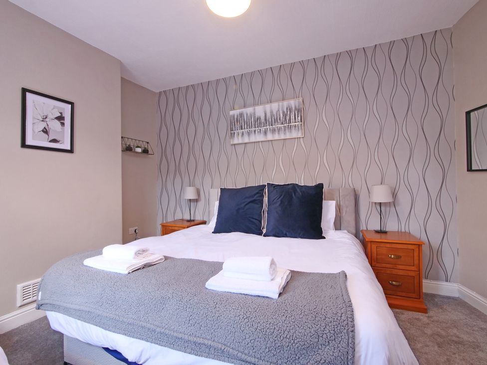 A bedroom with a double bed and bedside tables at Ashville Grange Scarborough