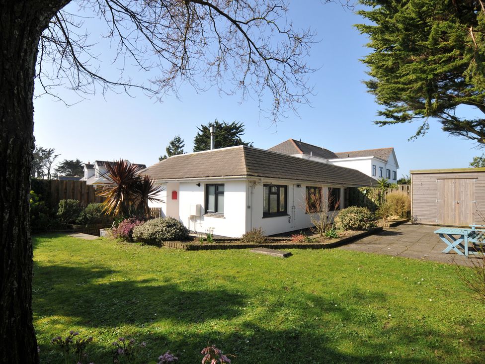 A house with a garden and patio at 6 Trelawney Court in Rock