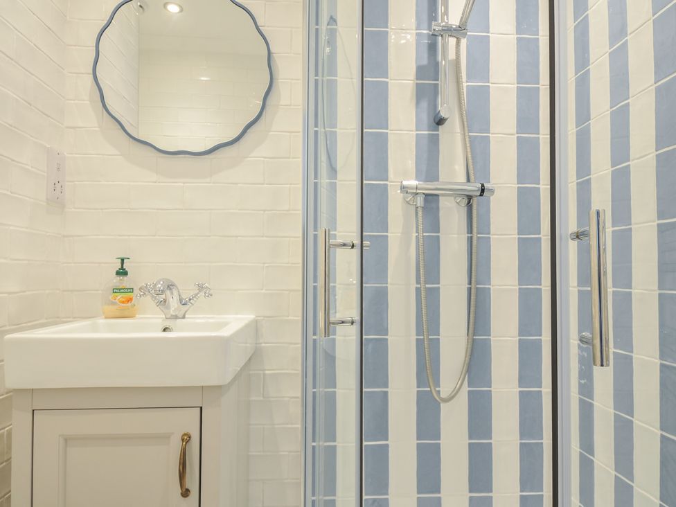 A bathroom with a sink and shower at 6 Trelawney Court Rock