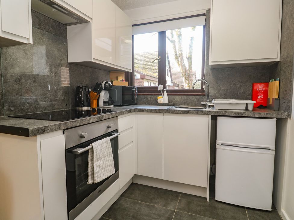 A kitchen with appliances and countertops at Tolroy Manor Holiday Park in St Erth Praze near Hayle