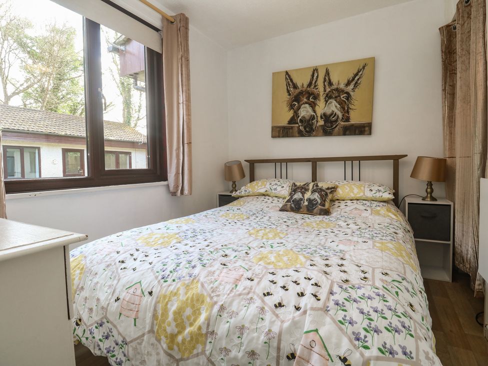 A bedroom with a double bed at Tolroy Manor Holiday Park St Erth Praze near Hayle