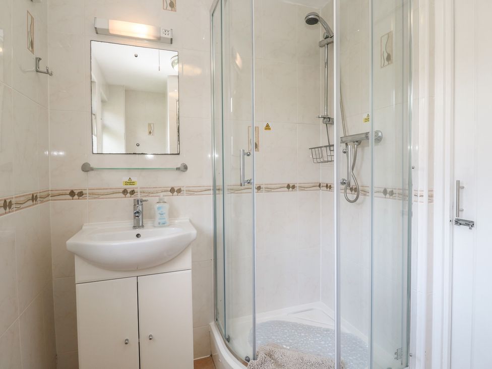 A bathroom with a shower and sink at Tolroy Manor Holiday Park St Erth Praze near Hayle