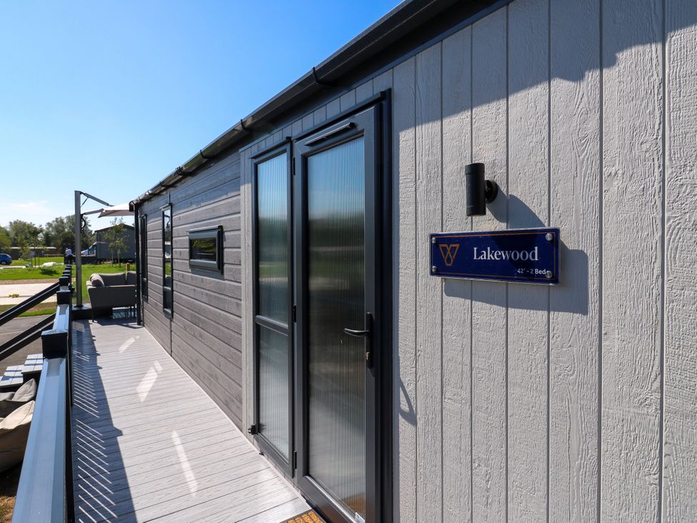 An exterior view of a building with a sign for Lakewood in St. Osyth
