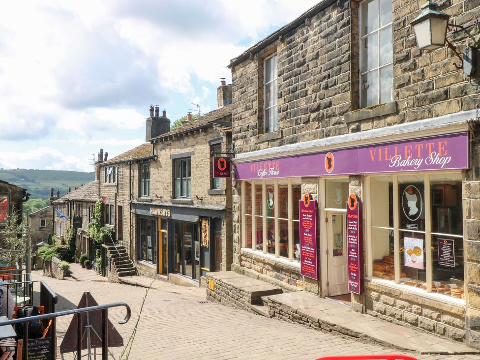 A street view with shops and steps at Penny Cottage in Haworth