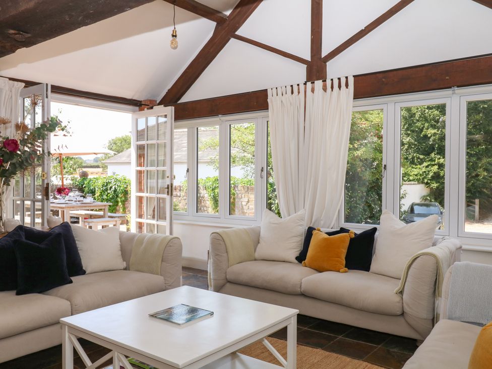 A living room with sofas and a coffee table at Apple Mill Venn Ottery near Sidmouth