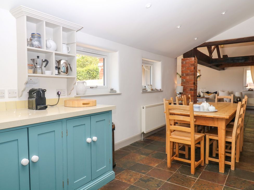A kitchen with a dining area at Apple Mill in Venn Ottery near Sidmouth