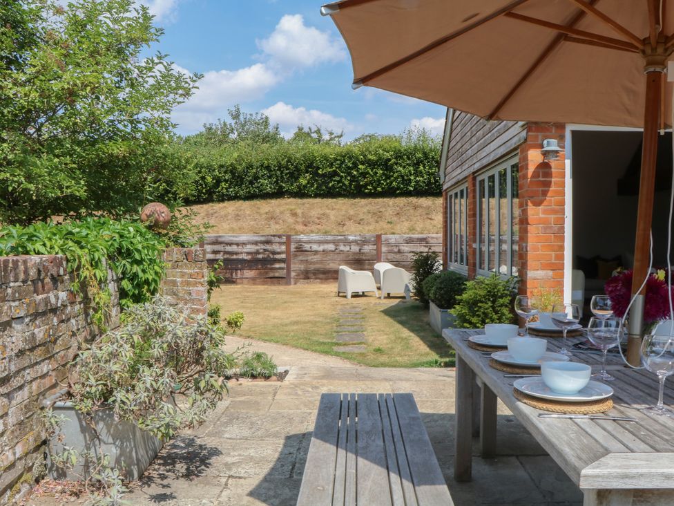 A garden with a dining table and chairs at Apple Mill Venn Ottery near Sidmouth