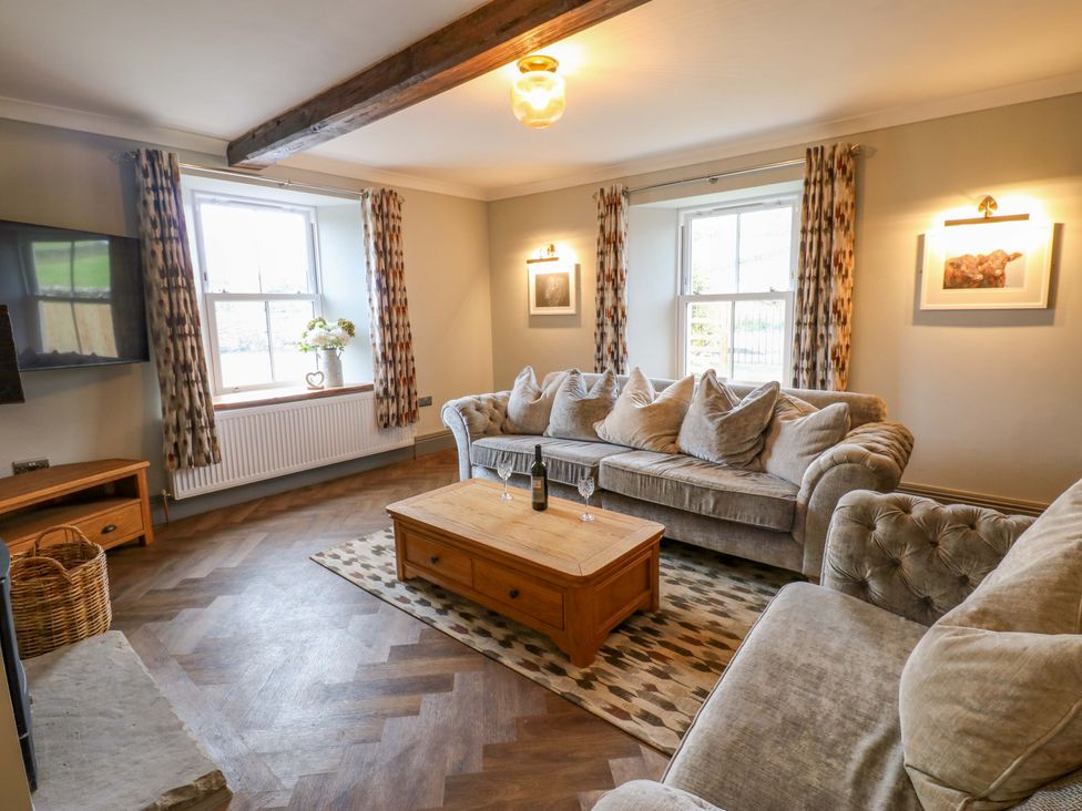 A living room with furniture and a television at Eastfield Farm in Barnard Castle