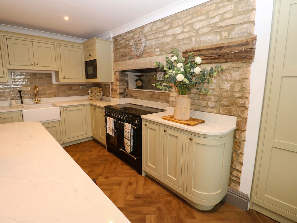 A kitchen with cabinetry and a cooking range at Eastfield Farm Barnard Castle