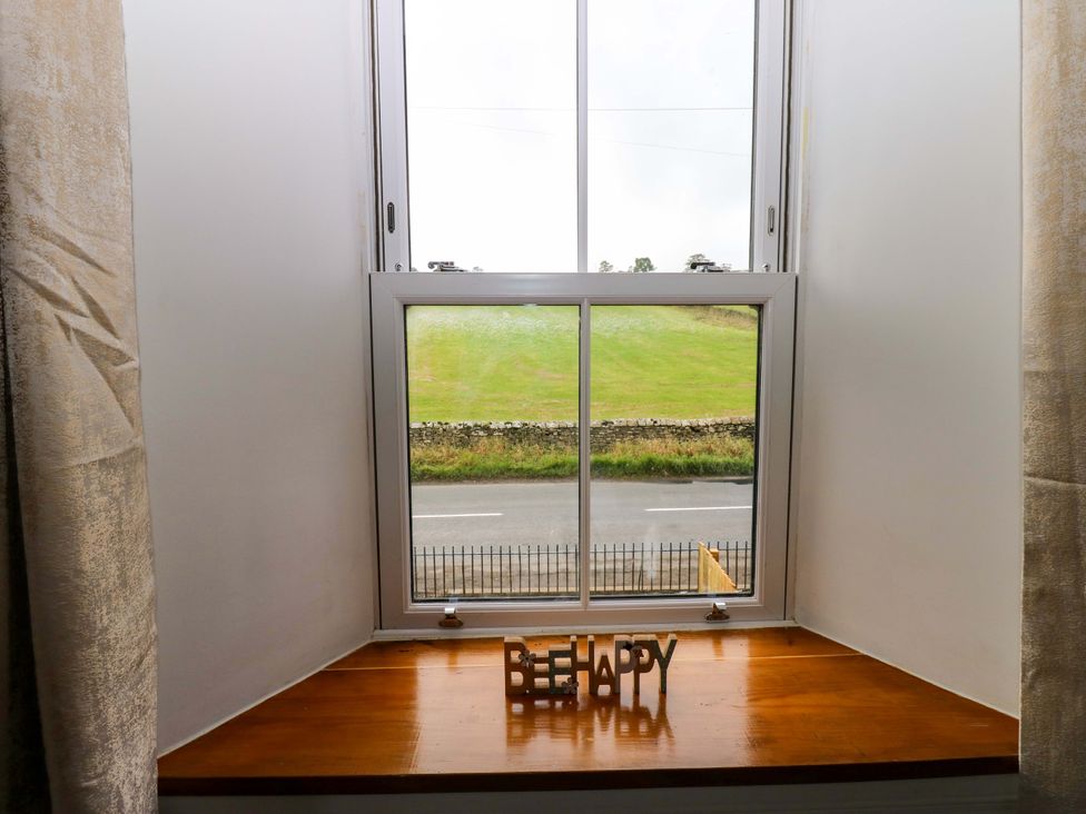 A window with a view and a wooden windowsill at Eastfield Farm, Barnard Castle