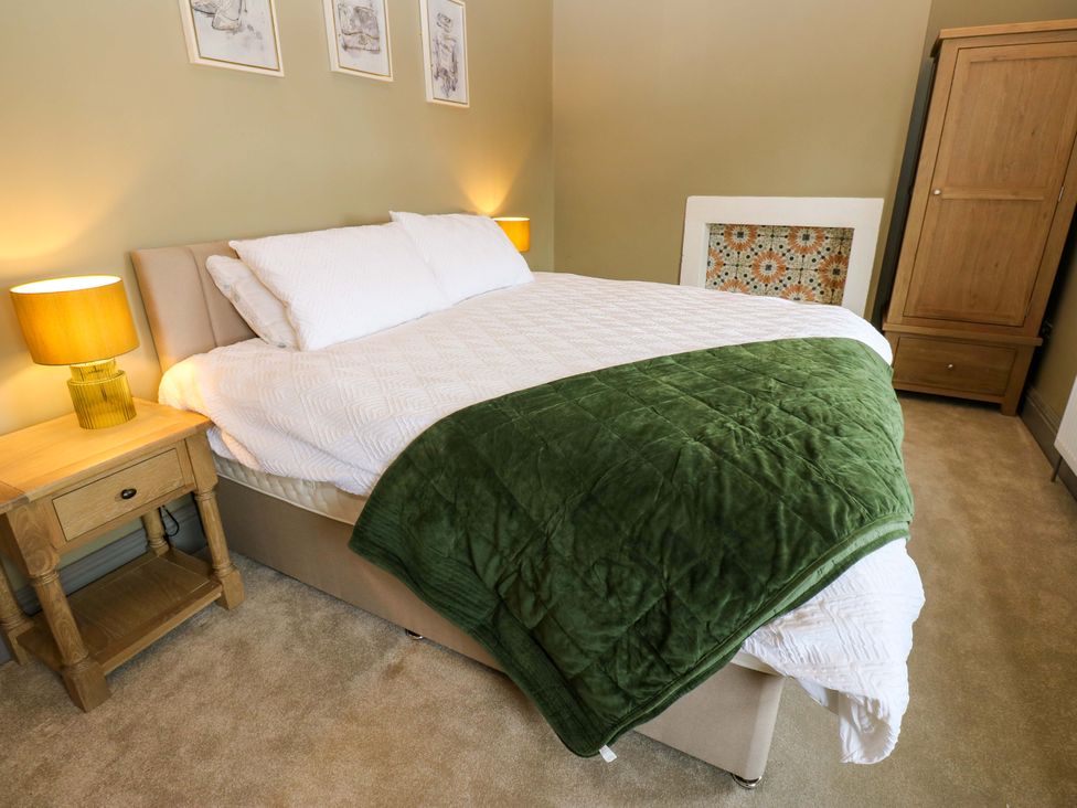 A bedroom with a bed and bedside table at Eastfield Farm in Barnard Castle