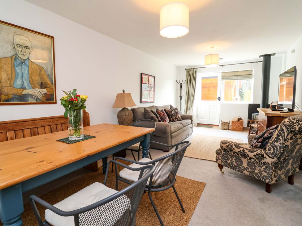 A living room with a dining table and sofa at Poplar Farm Studio Hatton Heath near Aldford