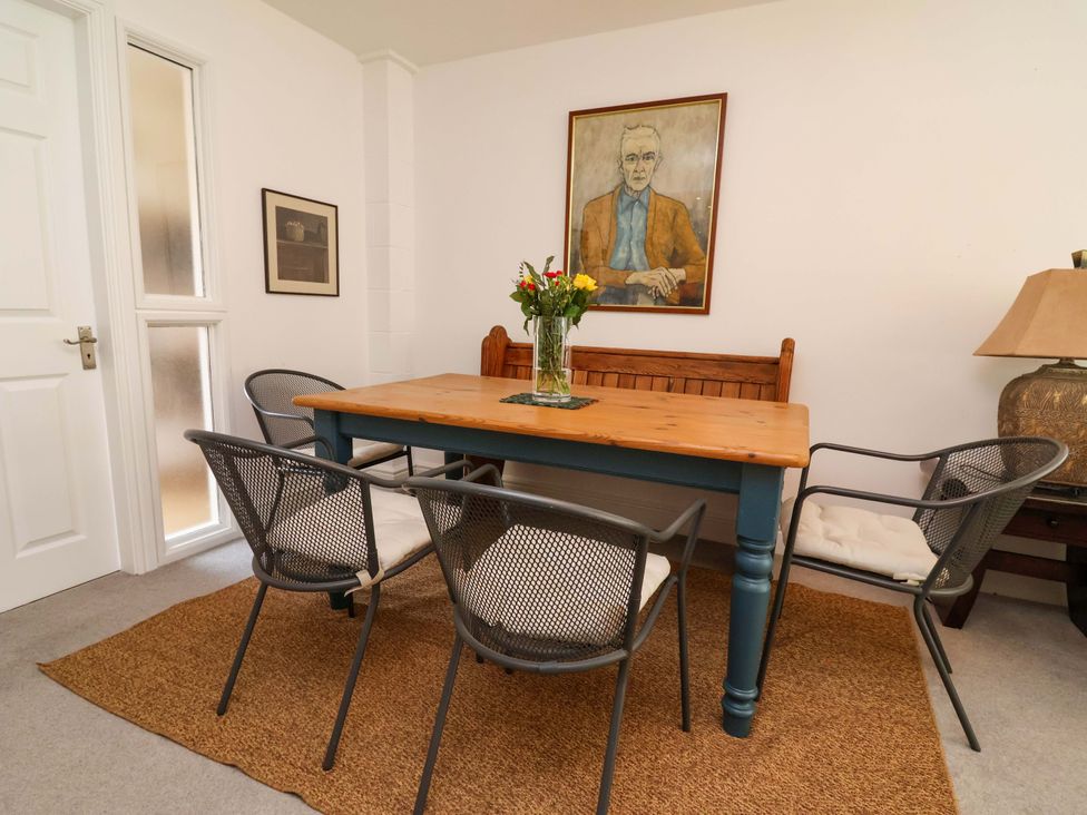 A dining room with a table and chairs at Poplar Farm Studio Hatton Heath near Aldford