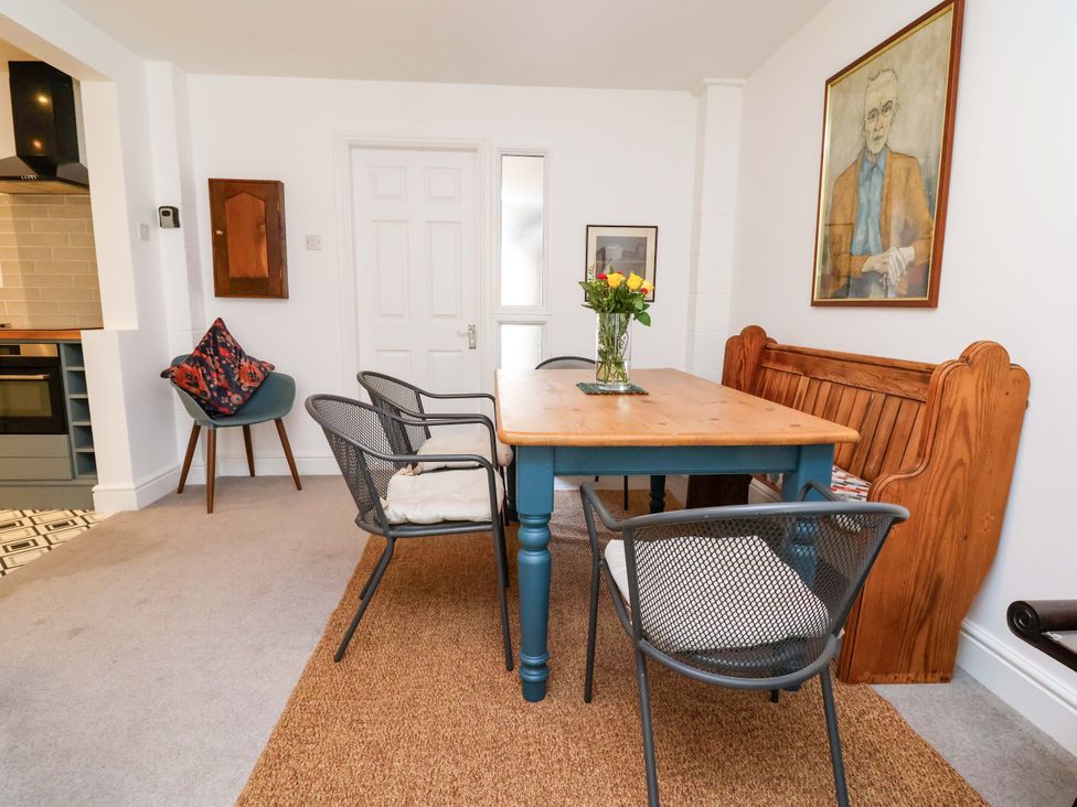 A dining room with a wooden table and chairs at Poplar Farm Studio Hatton Heath near Aldford