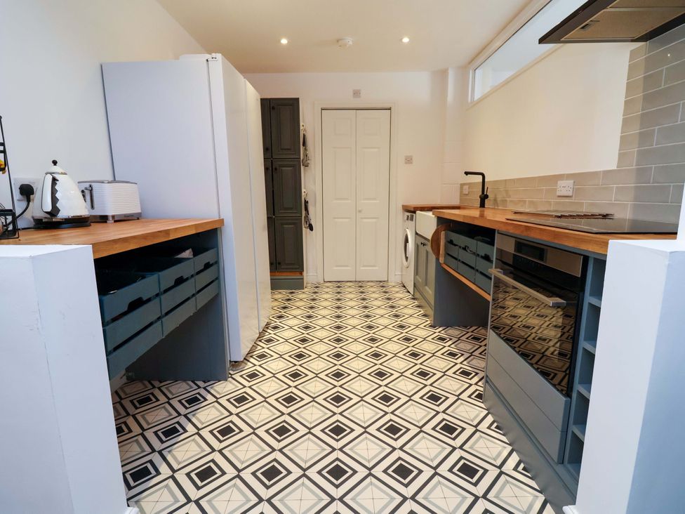 A kitchen with cabinets and appliances at Poplar Farm Studio Hatton Heath near Aldford