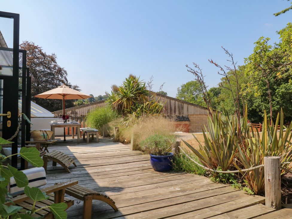 A garden with outdoor furniture and plants at Burrows Venn Ottery near Sidmouth