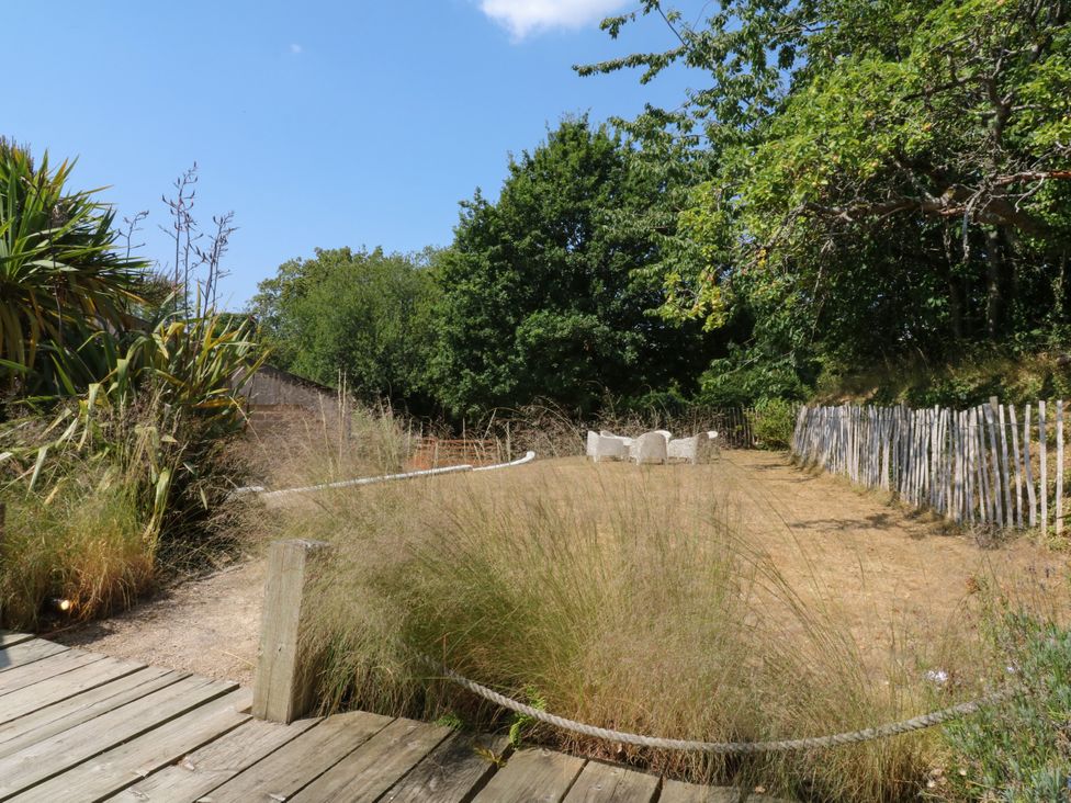 A garden with seating area and vegetation at Burrows Venn Ottery near Sidmouth