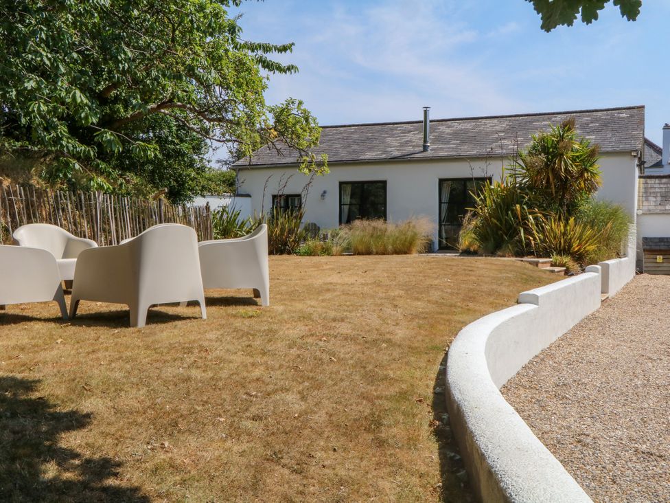 A garden with chairs and plants at Burrows in Venn Ottery near Sidmouth