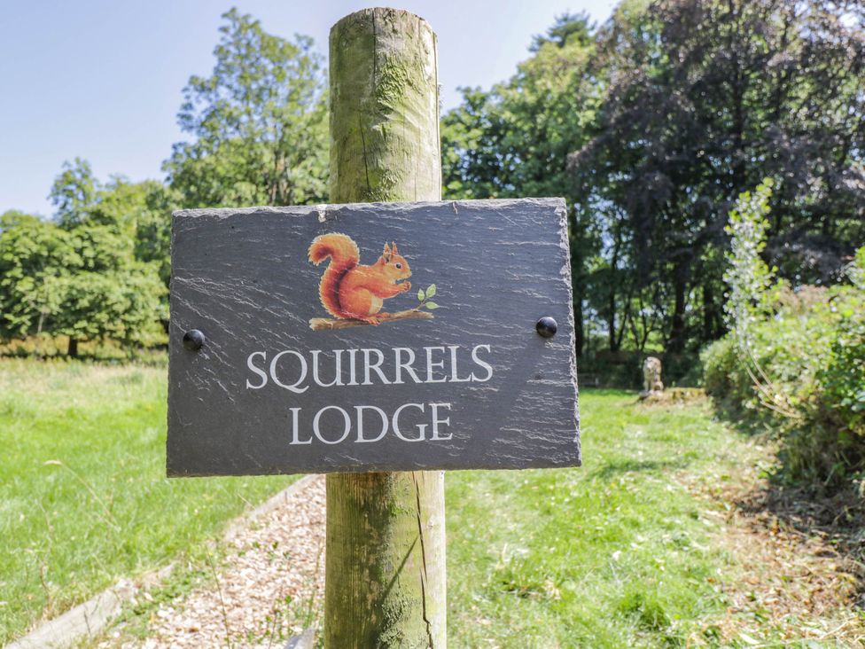 A sign for Squirrels Lodge in South Molton