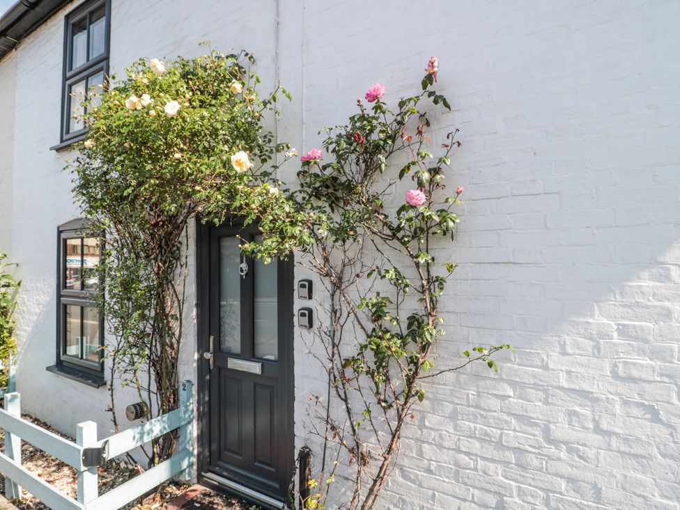 A door with flowers and windows at Stones Throw in Lymington