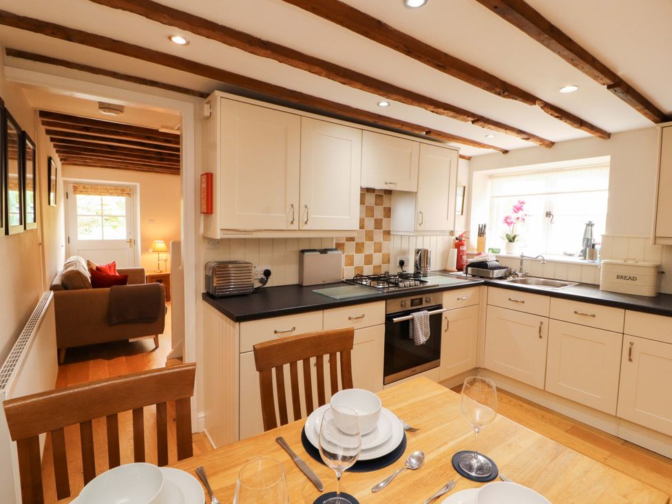A kitchen with dining table and chairs at Byways in Ambleside