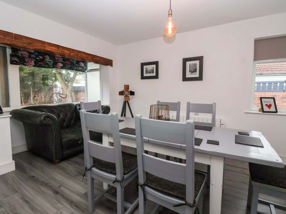 A dining room with a table and chairs at Fox Retreat in Sherburn
