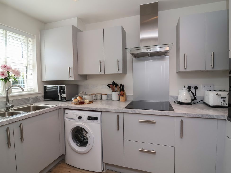 A kitchen with appliances and utensils at Seashell Sands in Appledore