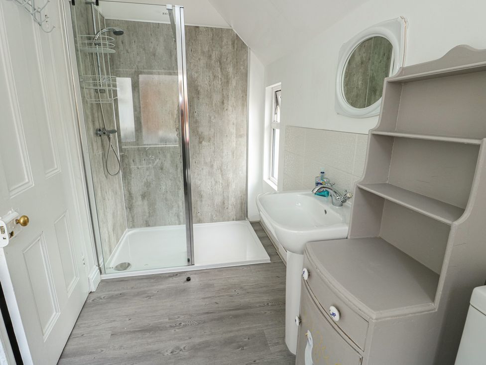 A bathroom with shower and sink at Noah's Rest in Llandudno