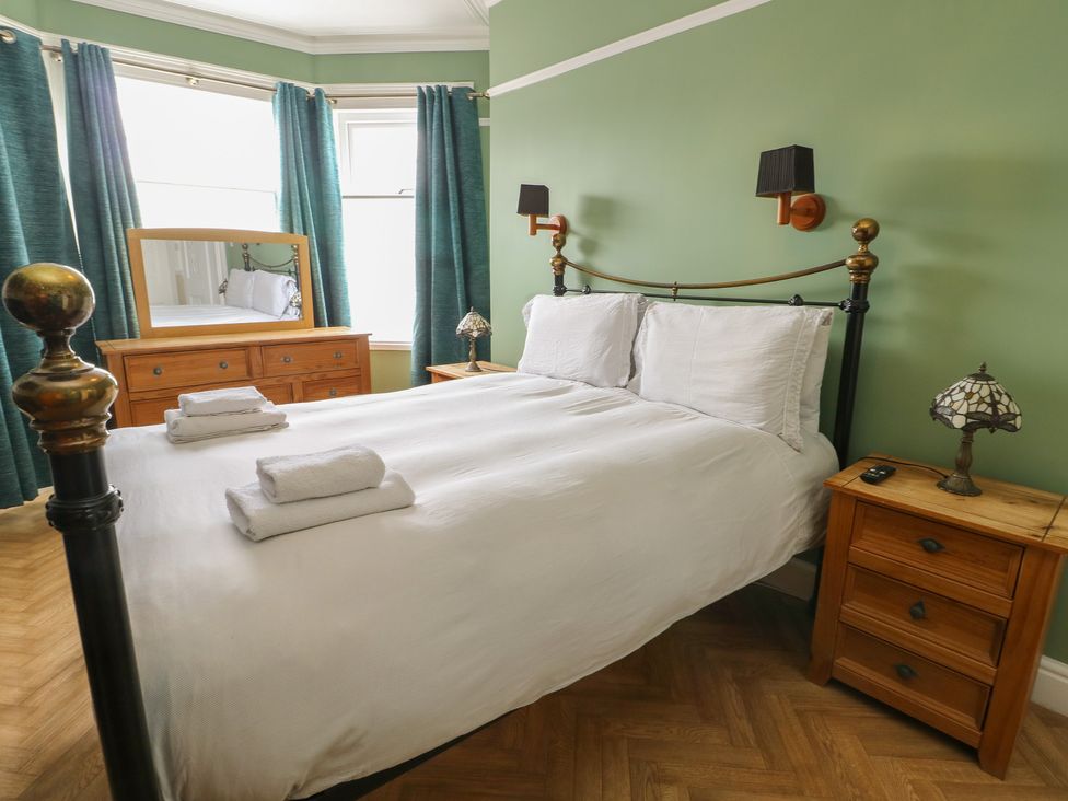 A bedroom with a bed and chest of drawers at Noah's Rest in Llandudno