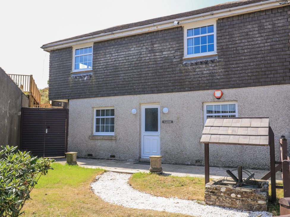 An exterior view of a property with a door and a well at Hougoumont Cottage in Torpoint
