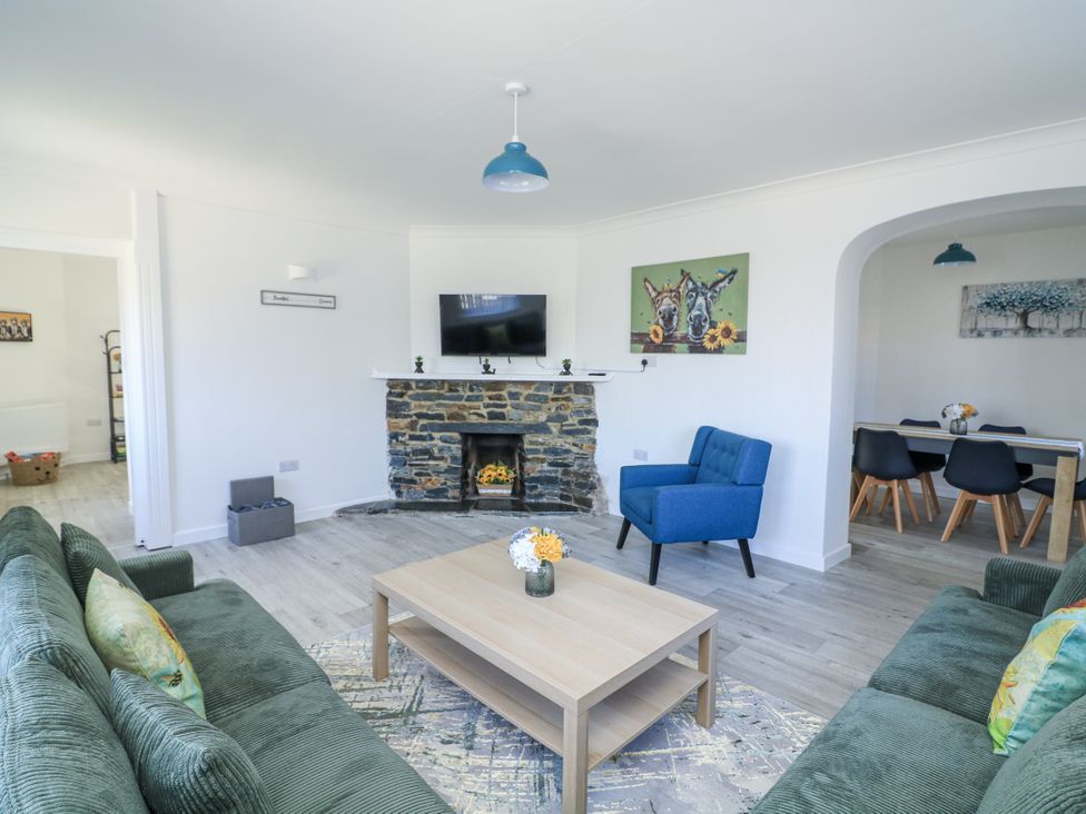 A living room with a sofa and coffee table at Hougoumont Cottage in Torpoint