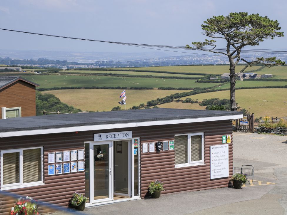 A reception building with a sign at Hougoumont Cottage in Torpoint