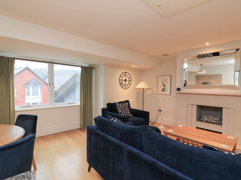 A living room with furniture and a view at 39 Dart Marina in Dartmouth