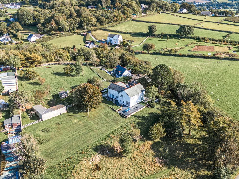 An aerial view of a property with a house and garden at The Manor House Skerry Vore Bryn Pydew near Llandudno Junction