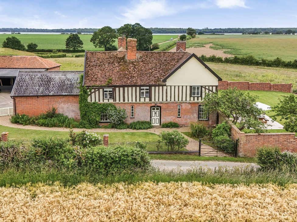 A house with a garden and fields at Knights Farm in Harkstead