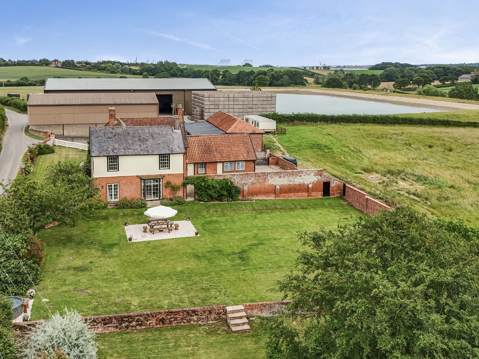 An outdoor view of a house and garden at Knights Farm in Harkstead