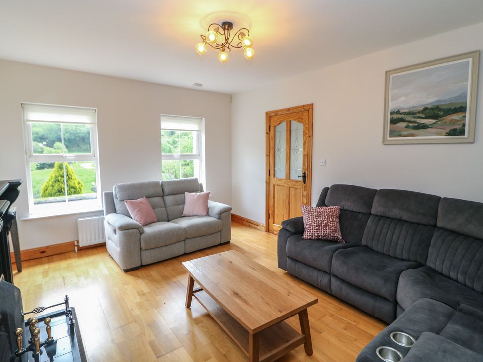 A living room with sofas and a coffee table at The Skating Rock in Bunane near Kenmare, County Kerry