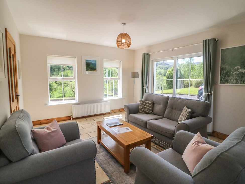 A living room with couches and coffee table at The Skating Rock in Bunane near Kenmare, County Kerry