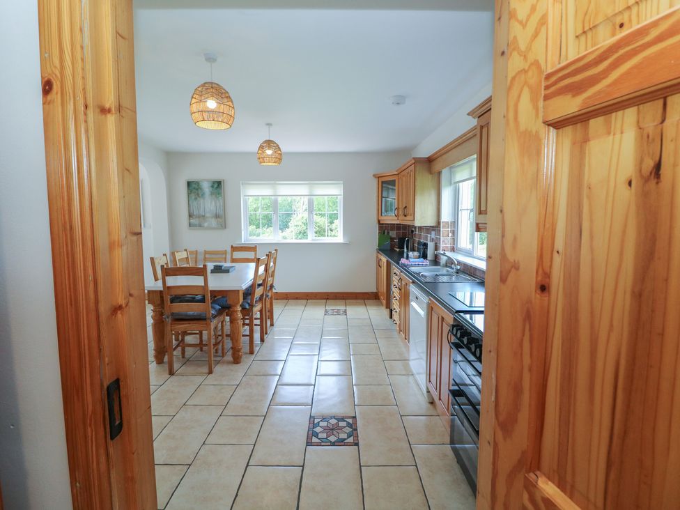 A kitchen with wooden furniture and appliances at The Skating Rock in Bunane near Kenmare County Kerry