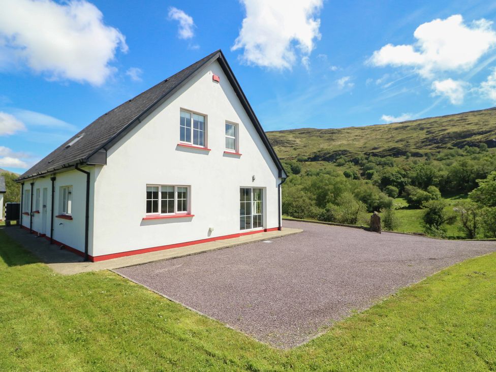 A house with windows and a driveway at The Skating Rock in Bunane near Kenmare, County Kerry