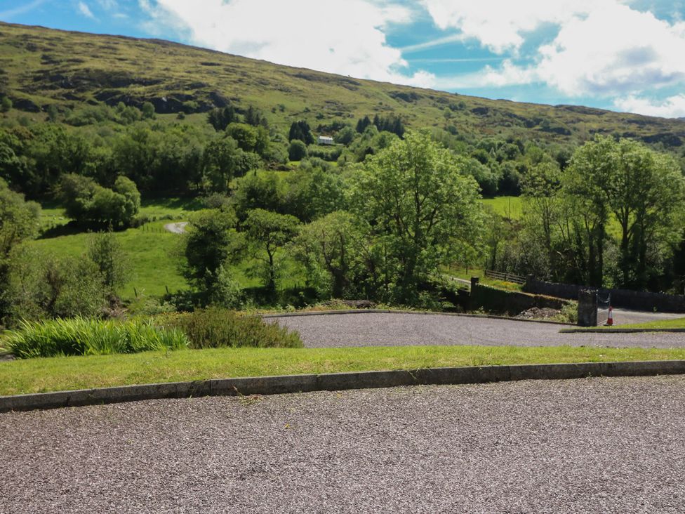 A scenic view of mountains and greenery at The Skating Rock in Bunane near Kenmare, County Kerry