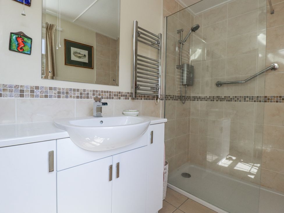 A bathroom with a sink and shower at Temple House in Goonhavern