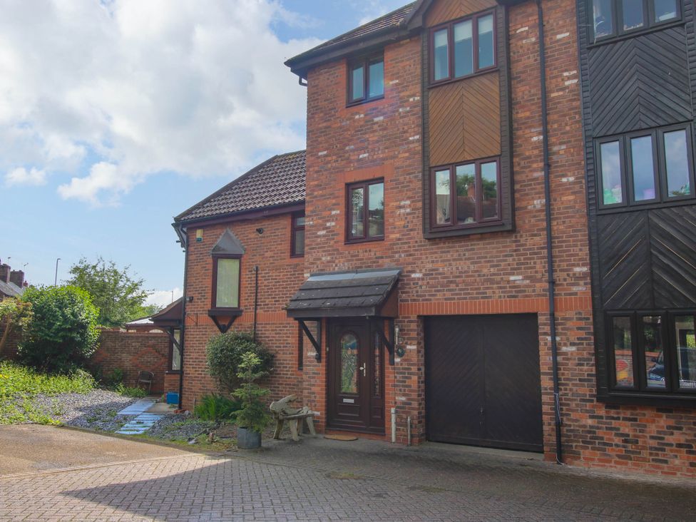 A brick house with a driveway a front door with a small porch and windows at 63 Severn Street in Bridgnorth